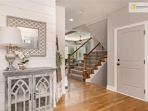 Warm and inviting entry way with shiplap detail and fresh paint