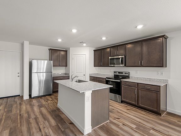 A spacious kitchen island is the perfect spot for food preparation.