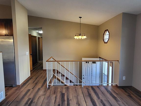 Open kitchen wall invites open viewing and conversation.