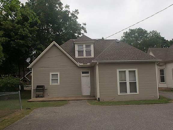 Rear of Triplex, Parking area, dog run on left