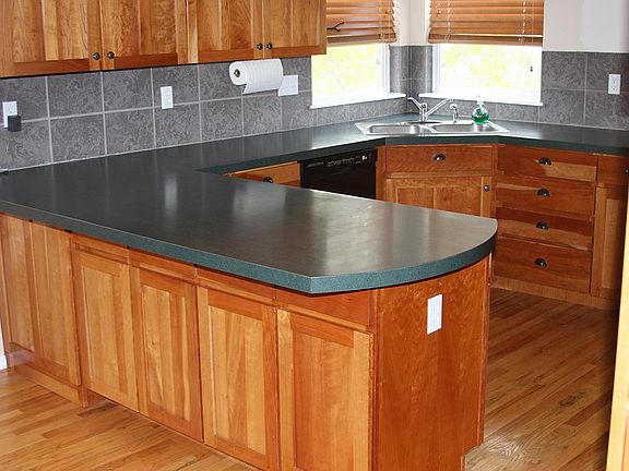 Cherry cabinets Oak hardwood floors