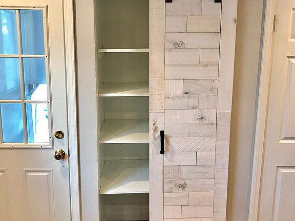 Barn door style sliding pantry