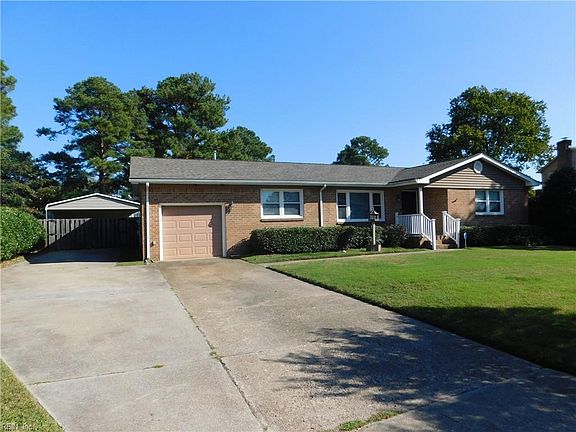 Two Car Driveway with Carport in rear of home.