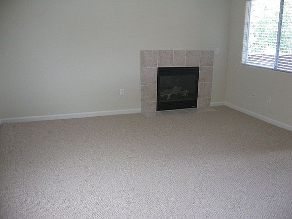 living room with large balcony and fireplace!