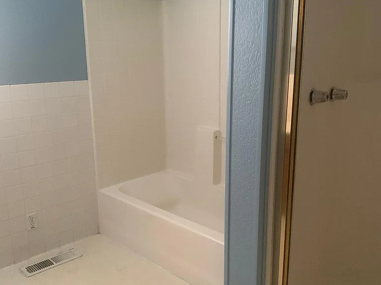 bath with shower tub view