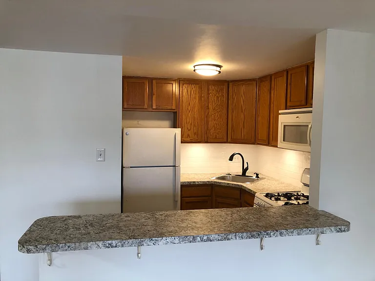 Kitchen with eating/prep bar