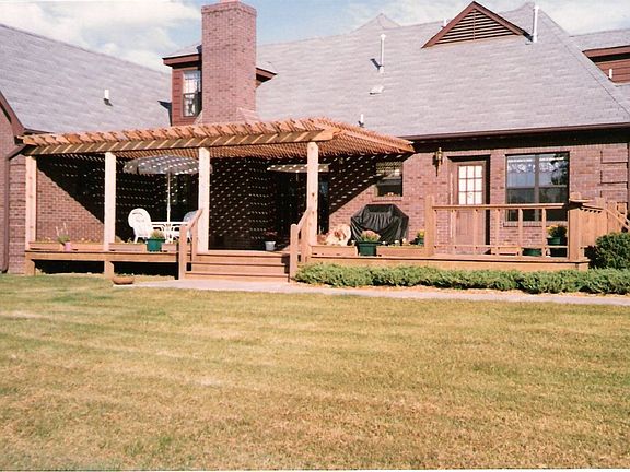 Back of house, arbor & deck.