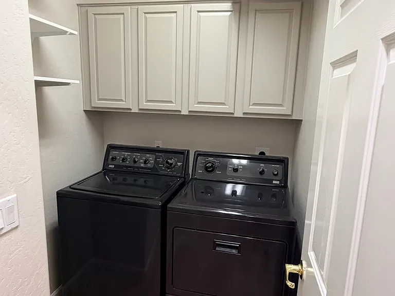 laundry room with plenty storage