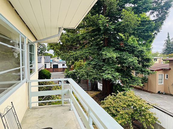 Looking out from front door. This shows the small deck area upstairs