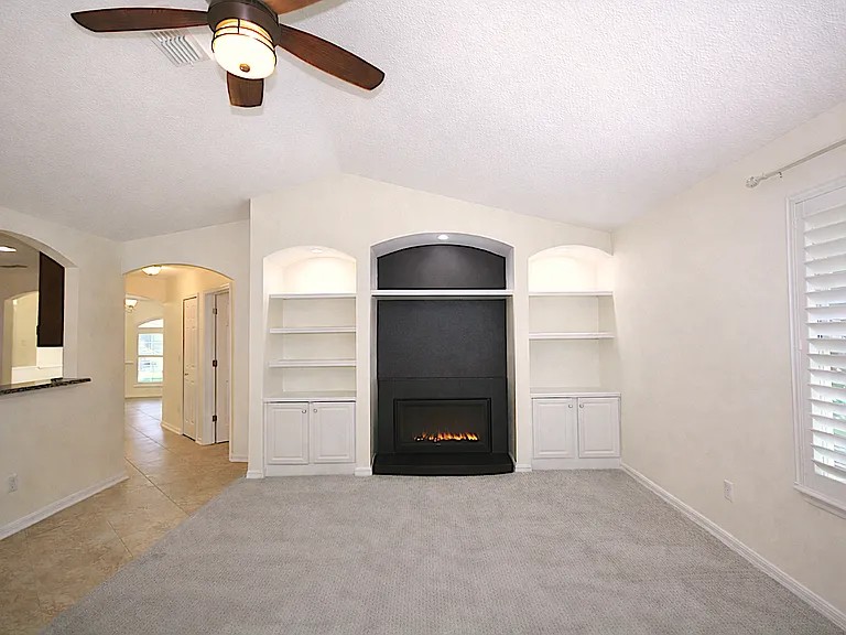 Living room with hallway to dining room, kitchen at left