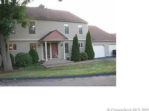 front exterior with garages