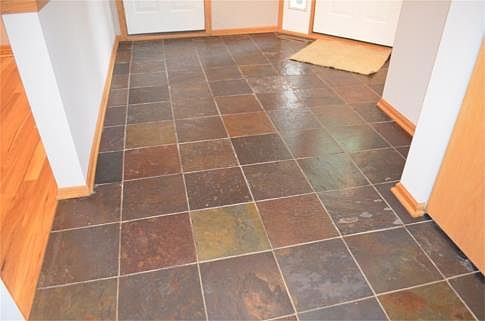 Rich, warm colors in the slate tile entry so no worries about wet boots and shoes. A generous bifold entry closet is great for storing all the coats and winter gear. ...