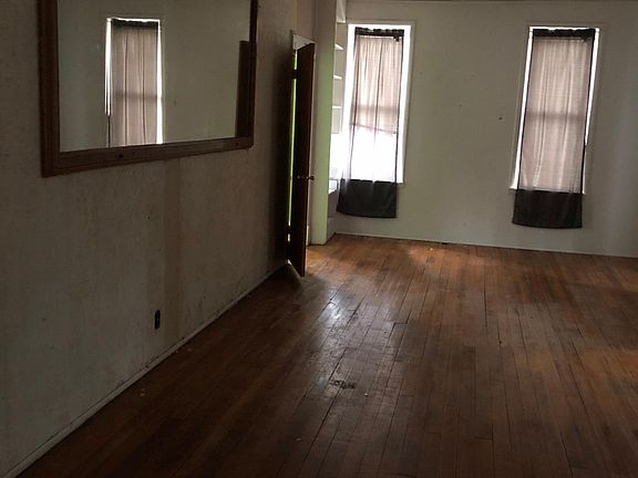 Living room permanently mounted mirror