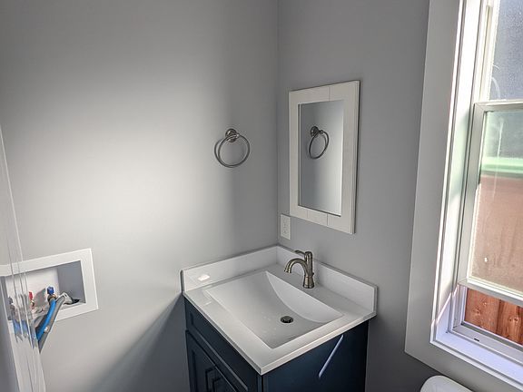 Half bathroom off the living and kitchen area.