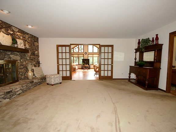 HOME IS GREAT FOR ENTERTANING, THIS VIEW IS FROM LIVING ROOM ALL THE WAY TO SUNROOM. POCKET DOORS BETWEEN LIVING AND FAMILY AND 