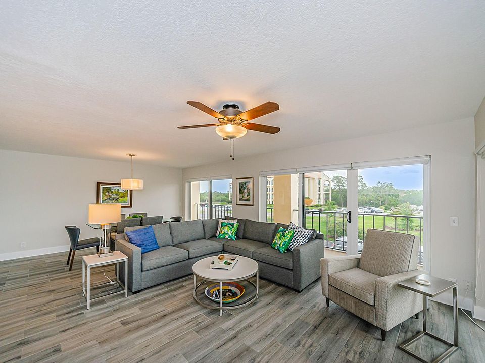 Living are with dining area behind the sofa