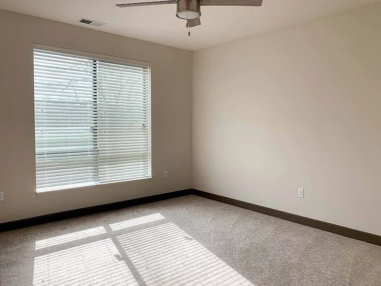 The primary bedroom of the two-bedroom Travertine