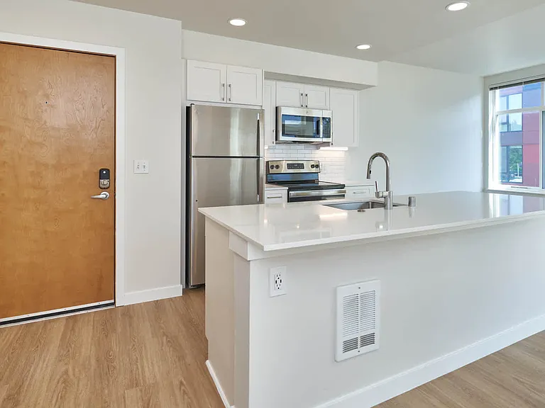 Kitchen with Stainless Steel Appliances and Breakfast Bar