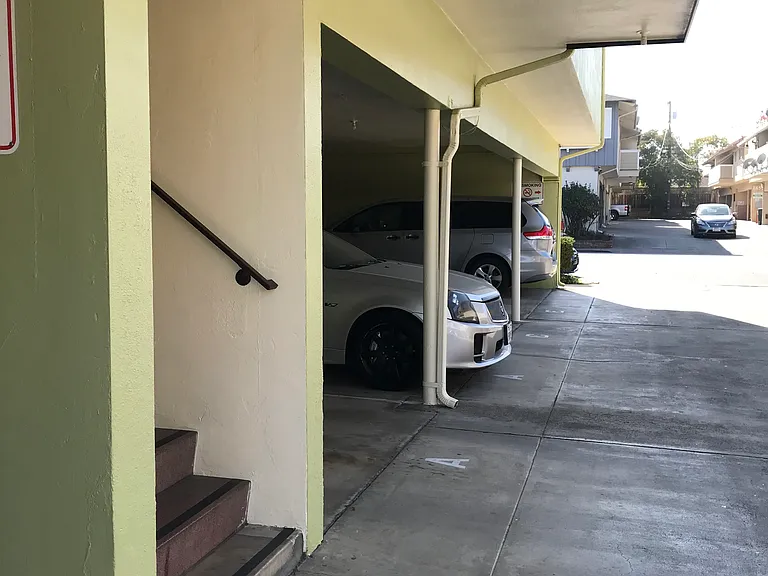 One assigned, covered carport parking space has quick access to the rear entry door. Two assigned, storage wall cabinets are conveniently provided in the covered carport area.