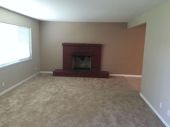 Spacious with brick fireplace