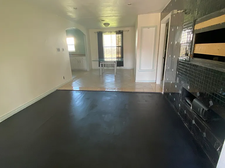 Living room is spacious and open concept to dining room and kitchen.