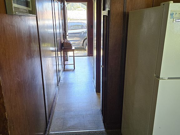 Pass through the hallway to discover the inviting space of the kitchen and living area.