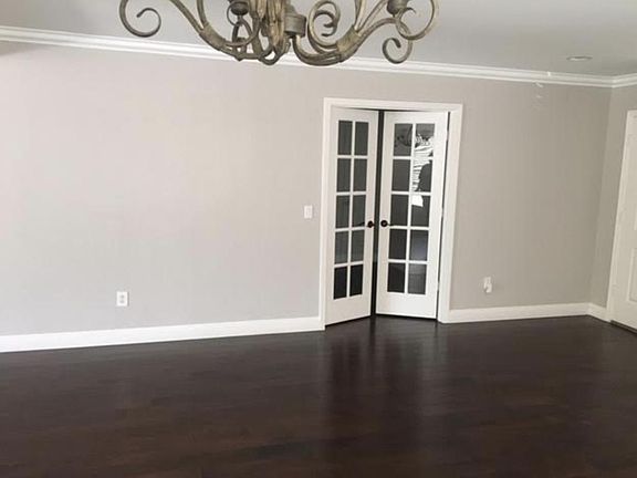 living room with 4th bedroom or closet