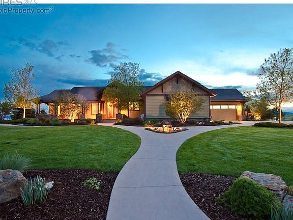 Perfect sited on 2 acres with manicured grounds