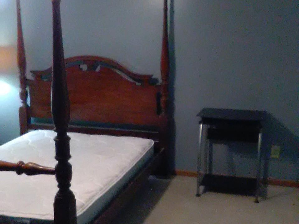 Queen size bed with pillow top mattress.