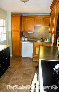 Updated kitchen
						:
						New in 2009 - flooring, cabinets and countertops. Appliances stay!