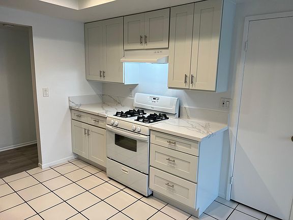 Large Kitchen with Dining Area and New Cabinets and Countertops
