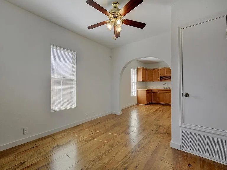 Gorgeous wood floors and arched entry way.
