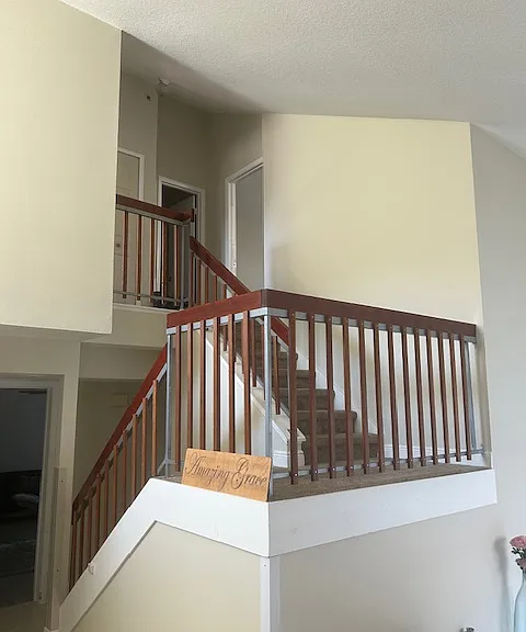 stairs to the two bedrooms upstairs