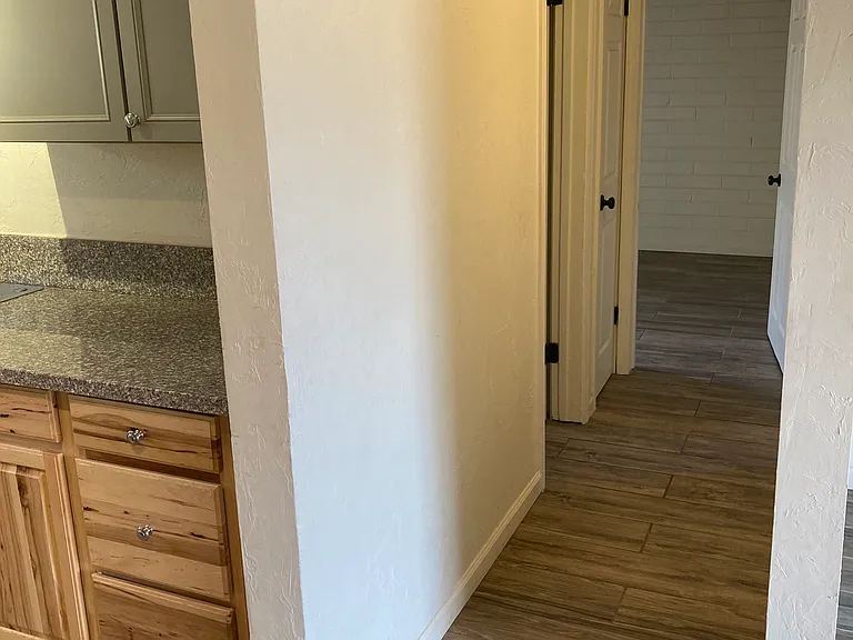 hall sets back for privacy to bath and bedrooms