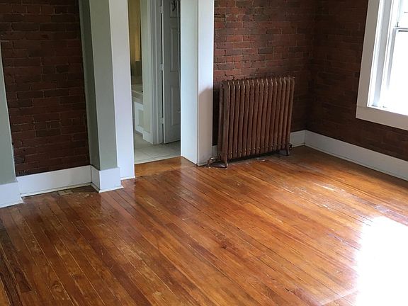 Master bedroom with exposed brick