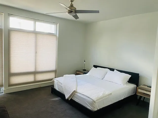 Large master bedroom with comfortable, new, hybrid mattress.