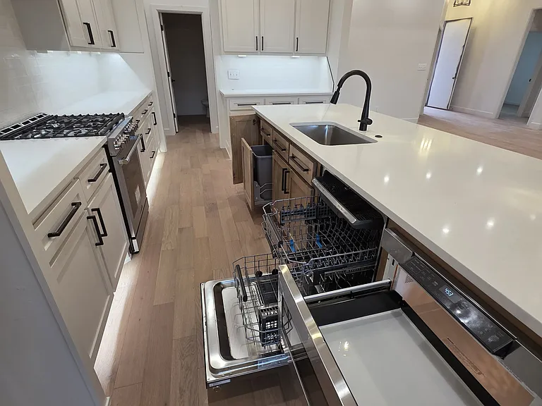 Super fun kitchen with hide away trash cans, cookie sheet storage, drawer microwave, and 3 rack dishwasher