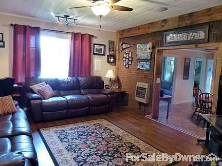 1st Floor Family Room
						:
						Renovated family room w/ large picture window flanked by two casement windows.