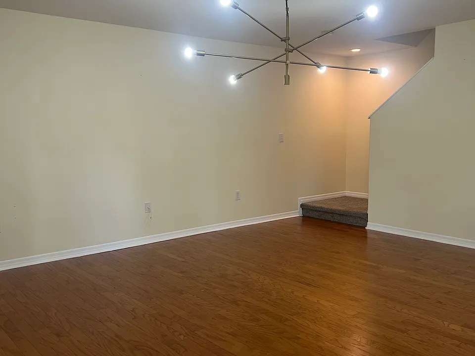 Open space living room, with beautiful wood floors!