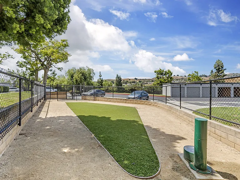 The Summit's dog park has grassy spots, shaded trees, and water stations to keep your pets cool and refreshed.
