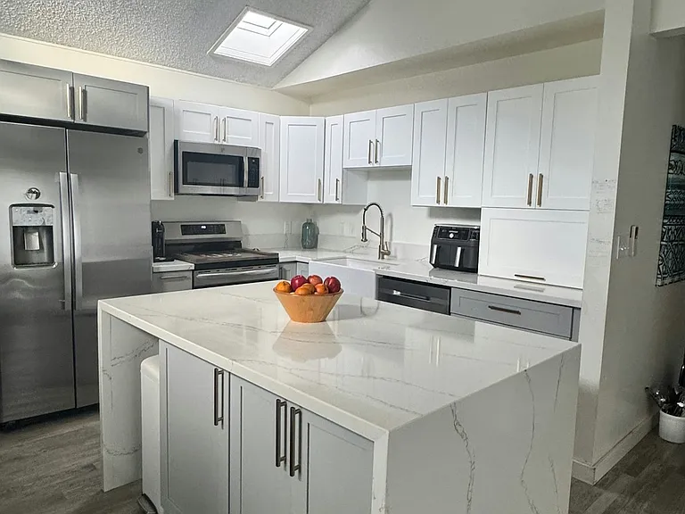 Remodeled kitchen with storage under center island