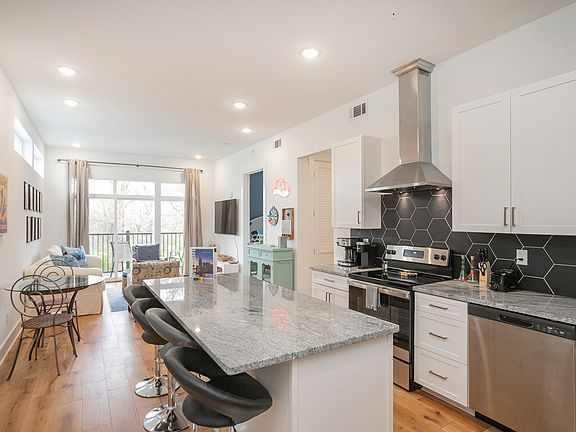 Luxury kitchen with everything you need including coffee bar, tea kettle, blender, dishwasher and fully stocked kitchen.