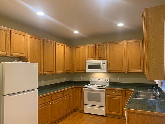 Kitchen has TONS of cabinets & counterspace plus a built in microwave.