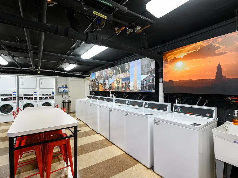 A laundry facility with large hanging photos in Old Town, Alexandria, VA.