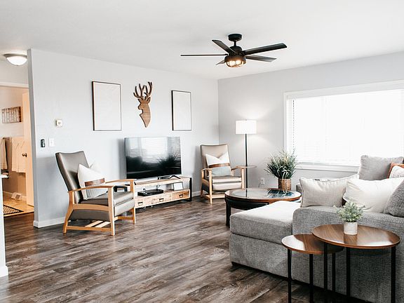 Large front room freshly painted with large windows, laminate flooring!