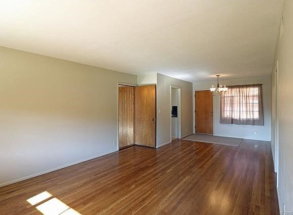 Living Room and Dining Room from Front Door.  Wood floors have just been professionally refinished--beautiful!