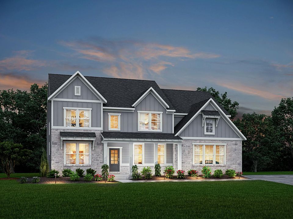 two-story home with board and batten, siding and stone