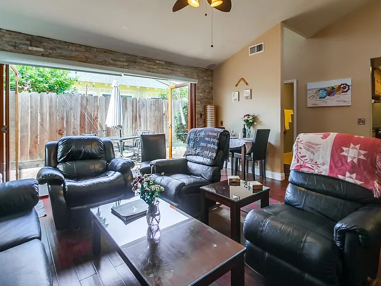 Living room opens completely to patio when living room glass wall panels are folded. Indoor/Outdoor living