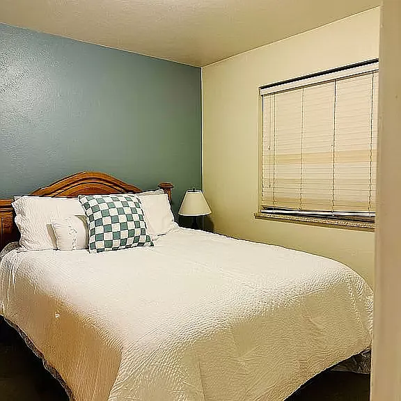 Queen bed with two large closets.
