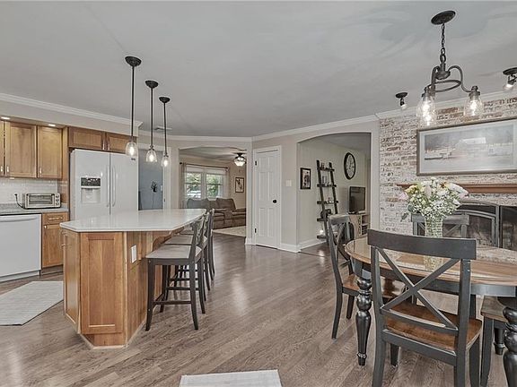 Open Floorplan flows between Kitchen, Dining, Living, Family Rooms, Laundry and Half Bath